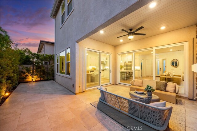 56 Cartwheel, Irvine, CA 92618 - patio terrace at dusk with a patio, ceiling fan, and an outdoor hangout area