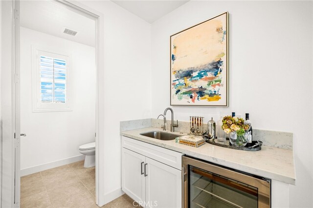 56 Cartwheel, Irvine, CA 92618 - indoor wet bar with wine cooler and light tile patterned floors