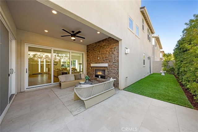56 Cartwheel, Irvine, CA 92618 - view of patio with a ceiling fan and an outdoor living space with a fireplace