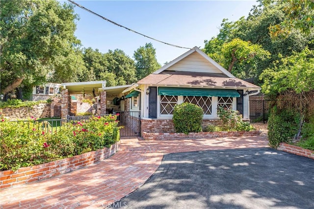 1125 Indian Springs Dr, Glendora, CA 91741 - view of front facade with a gate, brick siding, and a porch
