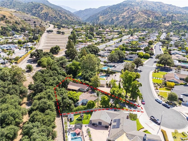1125 Indian Springs Dr, Glendora, CA 91741 - aerial view of residential area featuring a mountainous background and property parcel outlined