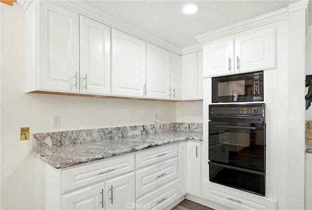 1125 Indian Springs Dr, Glendora, CA 91741 - kitchen with black appliances, a warming drawer, white cabinetry, recessed lighting, and light stone countertops