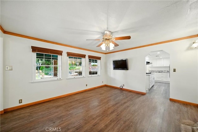 1125 Indian Springs Dr, Glendora, CA 91741 - unfurnished living room featuring a ceiling fan, dark wood-style flooring, ornamental molding, and arched walkways