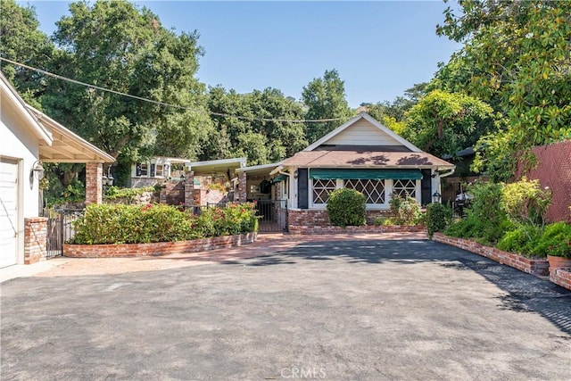 1125 Indian Springs Dr, Glendora, CA 91741 - view of front of property featuring a gate and asphalt driveway
