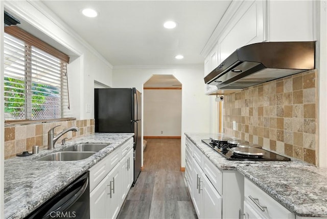 1125 Indian Springs Dr, Glendora, CA 91741 - kitchen with range hood, black appliances, arched walkways, backsplash, and ornamental molding