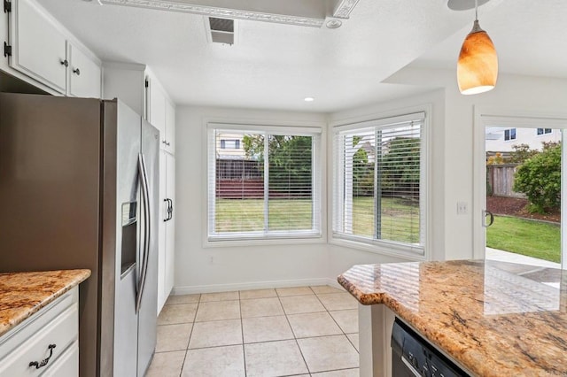 10559 Lansford Ln, San Diego, CA 92126 - kitchen with stainless steel fridge, light tile patterned floors, white cabinetry, pendant lighting, and light stone counters