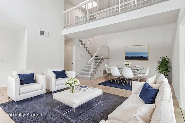 10559 Lansford Ln, San Diego, CA 92126 - living area featuring tile patterned flooring, a high ceiling, and stairway