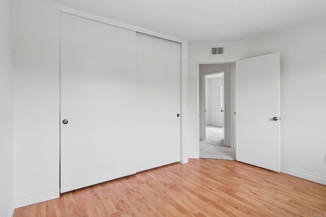 10559 Lansford Ln, San Diego, CA 92126 - unfurnished bedroom featuring light wood-type flooring and a closet