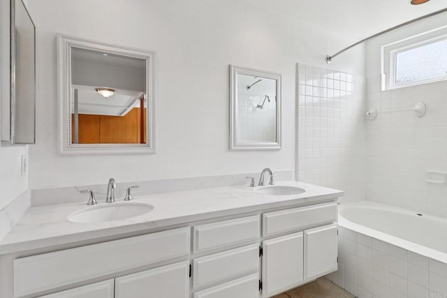 10559 Lansford Ln, San Diego, CA 92126 - full bathroom with double vanity and tiled shower / bath