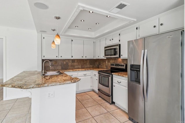 10559 Lansford Ln, San Diego, CA 92126 - kitchen featuring stainless steel appliances, a peninsula, a raised ceiling, light tile patterned floors, and white cabinetry