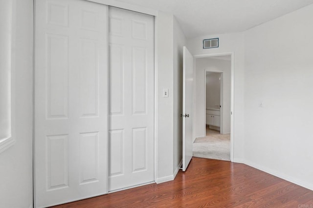 10559 Lansford Ln, San Diego, CA 92126 - unfurnished bedroom with dark wood-style flooring and a closet