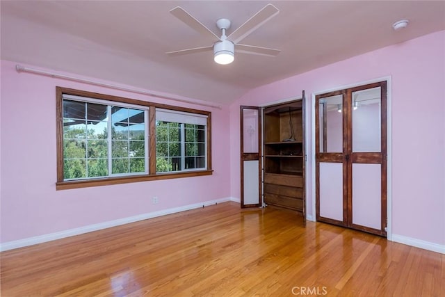 1835 Las Flores Dr, Glendale, CA 91207 - unfurnished bedroom featuring light wood-type flooring, vaulted ceiling, and ceiling fan