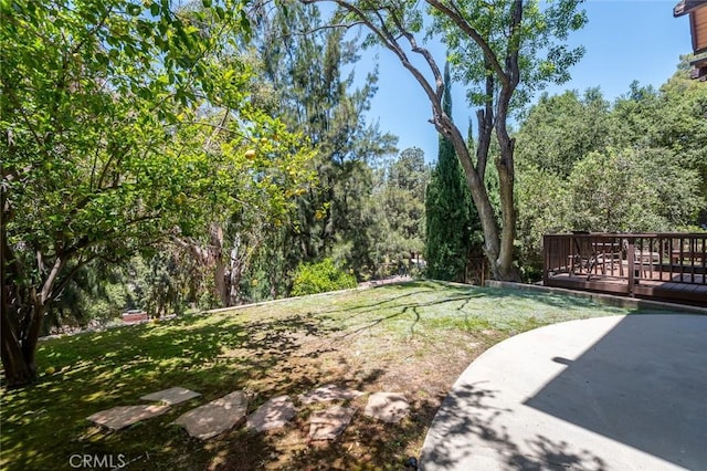 1835 Las Flores Dr, Glendale, CA 91207 - view of grassy yard featuring a deck and a patio