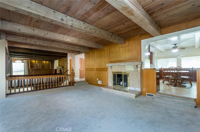1835 Las Flores Dr, Glendale, CA 91207 - unfurnished living room featuring a wooden ceiling with exposed beams, a ceiling fan, carpet flooring, a fireplace, and wooden walls