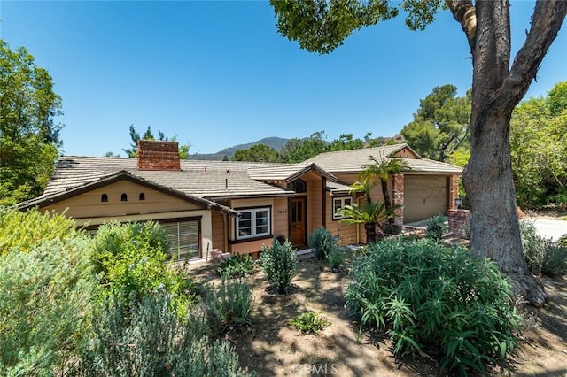 1835 Las Flores Dr, Glendale, CA 91207 - ranch-style house featuring an attached garage, a chimney, and a mountain view