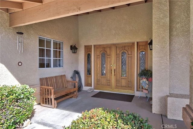 18032 Ohna Rd, Apple Valley, CA 92307 - entrance to property with stucco siding and a porch