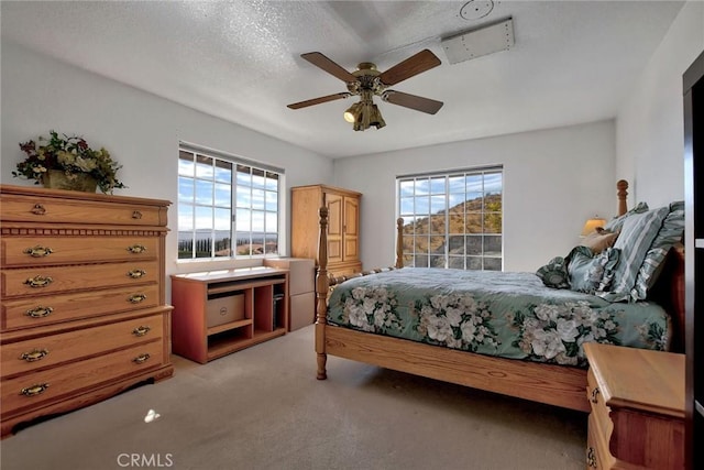 18032 Ohna Rd, Apple Valley, CA 92307 - bedroom with light colored carpet and ceiling fan