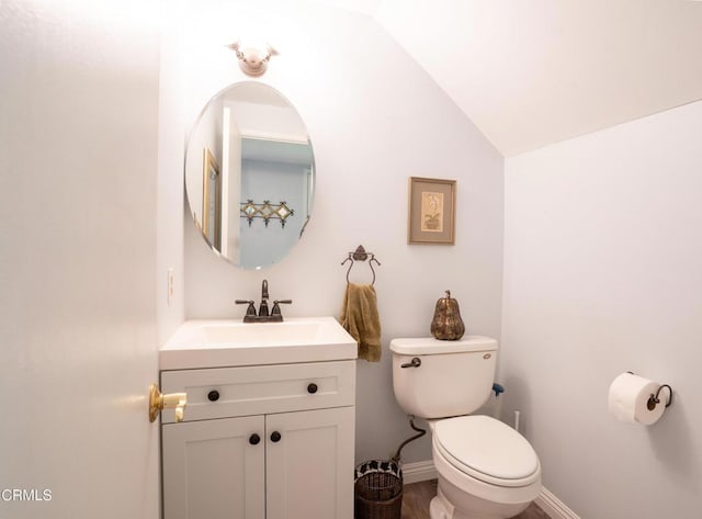 1584 Prima Ct, Camarillo, CA 93010 - half bath with vanity, vaulted ceiling, and wood finished floors
