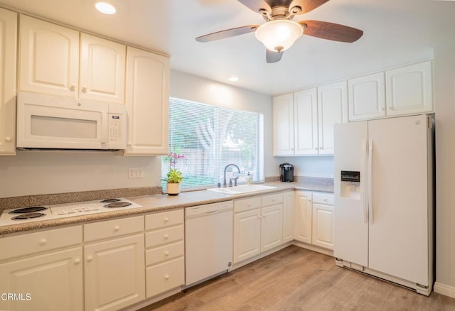 1584 Prima Ct, Camarillo, CA 93010 - kitchen with white appliances, ceiling fan, light wood finished floors, white cabinetry, and light countertops