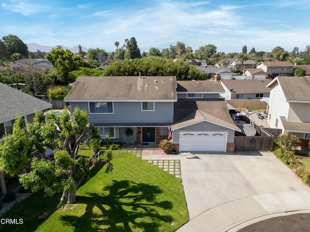1584 Prima Ct, Camarillo, CA 93010 - view of front facade with a residential view, concrete driveway, roof with shingles, and a garage