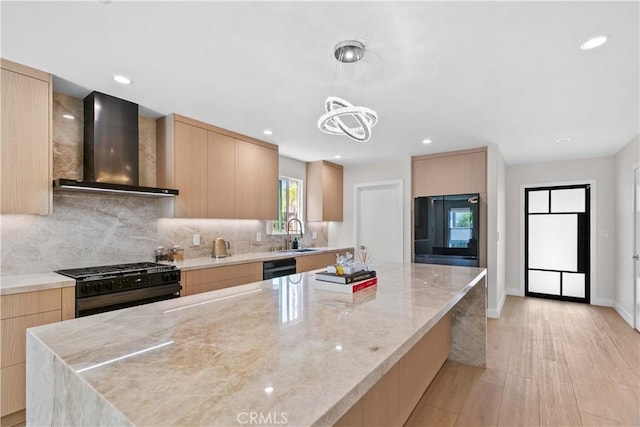 6832 Cantaloupe Ave, Van Nuys, CA 91405 - kitchen featuring wall chimney exhaust hood, black appliances, light brown cabinetry, modern cabinets, and recessed lighting