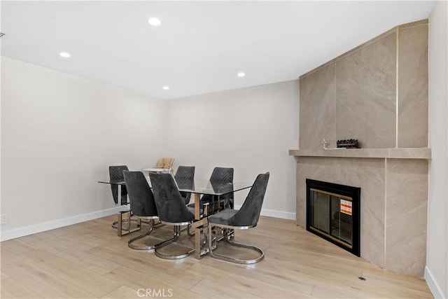 6832 Cantaloupe Ave, Van Nuys, CA 91405 - dining area featuring wood finished floors, a fireplace, and recessed lighting