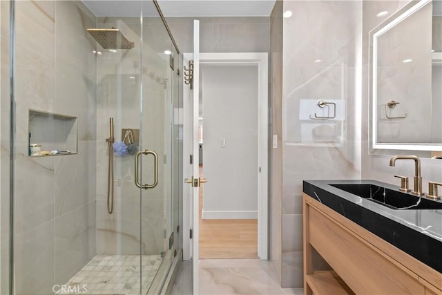 6832 Cantaloupe Ave, Van Nuys, CA 91405 - full bathroom with a stall shower, vanity, and marble finish flooring