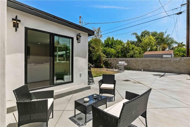 6832 Cantaloupe Ave, Van Nuys, CA 91405 - fenced backyard with area for grilling, an outdoor hangout area, and a patio