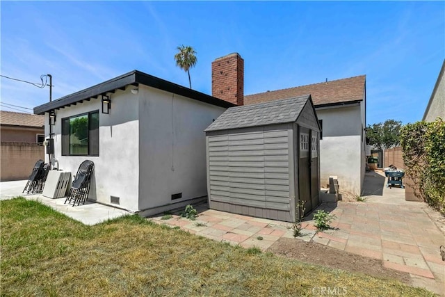 6832 Cantaloupe Ave, Van Nuys, CA 91405 - rear view of property featuring crawl space, a patio area, a shed, and stucco siding