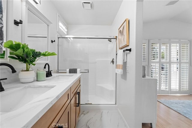 2 Chestnut Dr, Aliso Viejo, CA 92656 - bathroom featuring double vanity, a shower stall, and lofted ceiling