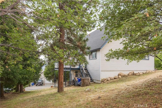 27786 Matterhorn Dr, Lake Arrowhead, CA 92352 - view of side of property featuring stairs, a yard, and a shingled roof