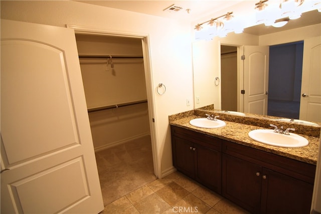 629 Traction Ave Unit 508, Los Angeles, CA 90013 - full bathroom featuring double vanity and a spacious closet