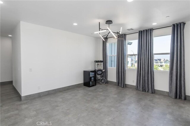 18824 Juniper Springs Dr, Canyon Country, CA 91321 - empty room featuring recessed lighting, finished concrete floors, and a chandelier