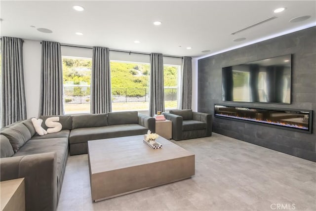 18824 Juniper Springs Dr, Canyon Country, CA 91321 - living area with plenty of natural light, recessed lighting, wood finished floors, and a glass covered fireplace