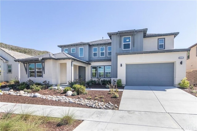 18824 Juniper Springs Dr, Canyon Country, CA 91321 - prairie-style house with concrete driveway, stucco siding, and an attached garage