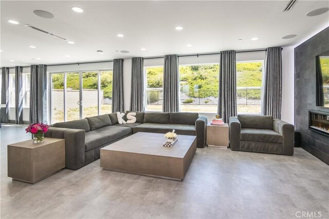 18824 Juniper Springs Dr, Canyon Country, CA 91321 - living area featuring healthy amount of natural light, concrete flooring, and recessed lighting