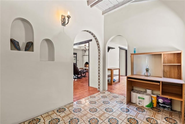 31039 Hasley Canyon Rd, Castaic, CA 91384 - corridor featuring arched walkways, beamed ceiling, a chandelier, and high vaulted ceiling
