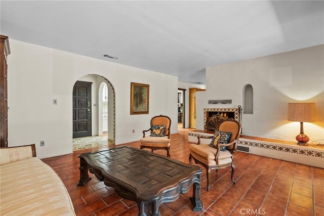 31039 Hasley Canyon Rd, Castaic, CA 91384 - living area featuring arched walkways and a fireplace