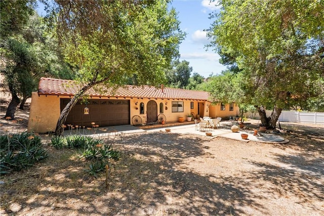 31039 Hasley Canyon Rd, Castaic, CA 91384 - view of front of home with a tile roof, a garage, stucco siding, and driveway