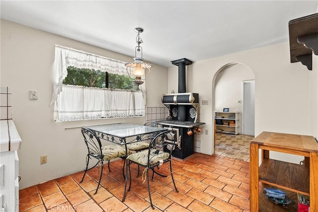 31039 Hasley Canyon Rd, Castaic, CA 91384 - dining room with arched walkways and a wood stove