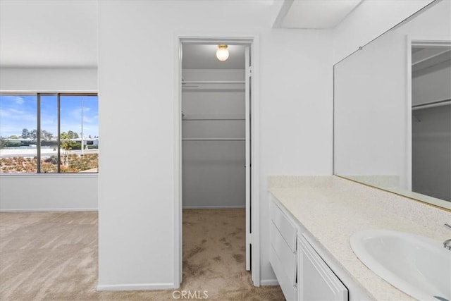 10473 Smoke River Ct, Fountain Valley, CA 92708 - bathroom with vanity and a spacious closet
