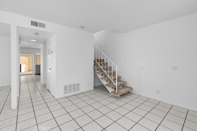 10473 Smoke River Ct, Fountain Valley, CA 92708 - empty room featuring stairs and light tile patterned flooring