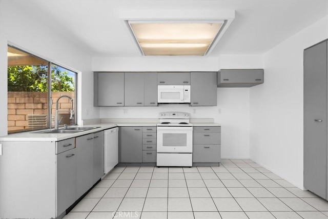 10473 Smoke River Ct, Fountain Valley, CA 92708 - kitchen featuring white appliances, gray cabinetry, and light countertops