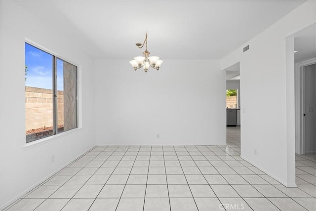 10473 Smoke River Ct, Fountain Valley, CA 92708 - empty room with a chandelier and light tile patterned flooring