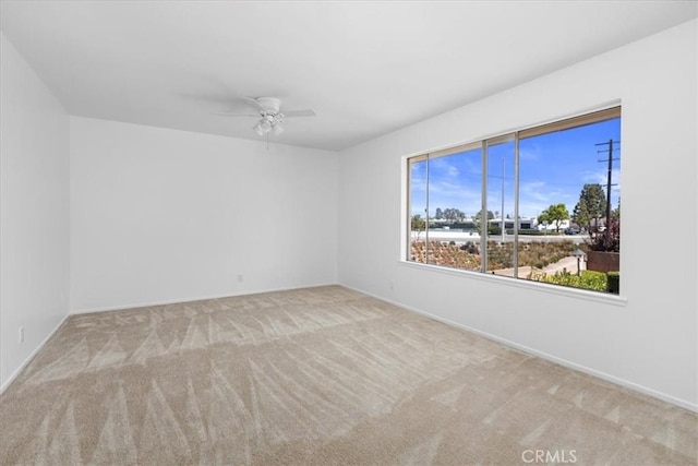 10473 Smoke River Ct, Fountain Valley, CA 92708 - carpeted spare room with a ceiling fan and baseboards