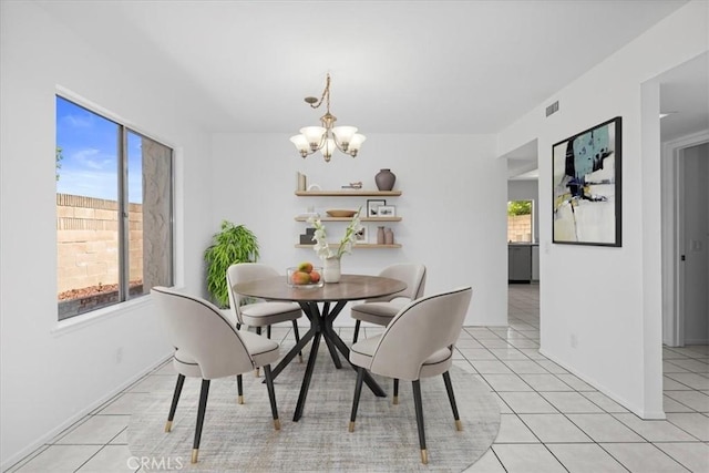 10473 Smoke River Ct, Fountain Valley, CA 92708 - dining area with a chandelier, healthy amount of natural light, and light tile patterned floors