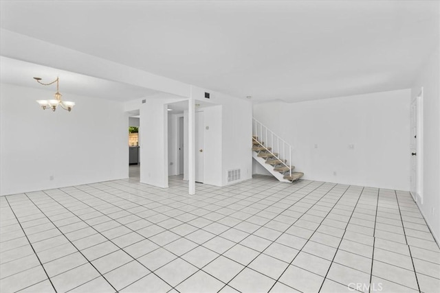 10473 Smoke River Ct, Fountain Valley, CA 92708 - unfurnished room with stairway and a chandelier