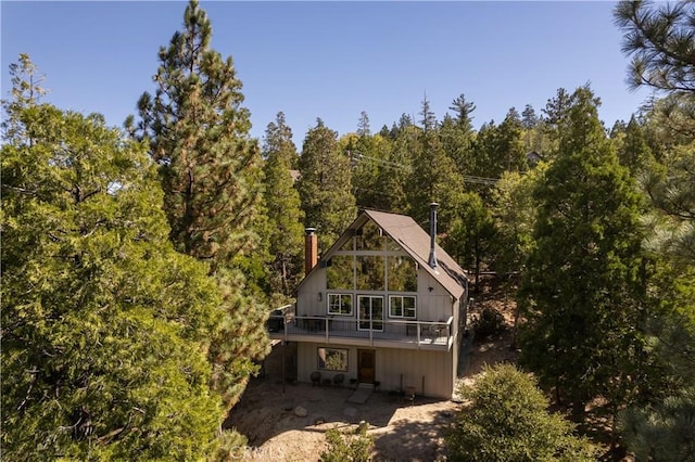 832 Rhine Rd, Lake Arrowhead, CA 92352 - back of house with a forest view and a wooden deck