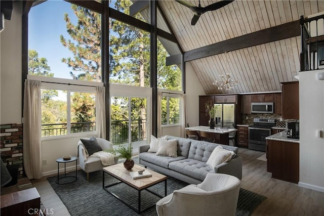 832 Rhine Rd, Lake Arrowhead, CA 92352 - living area featuring high vaulted ceiling, a chandelier, ceiling fan, beamed ceiling, and light wood-style floors