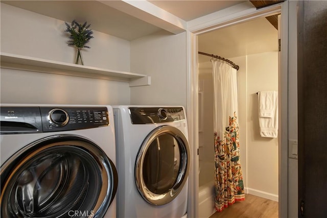 832 Rhine Rd, Lake Arrowhead, CA 92352 - laundry room featuring washer and clothes dryer and wood finished floors
